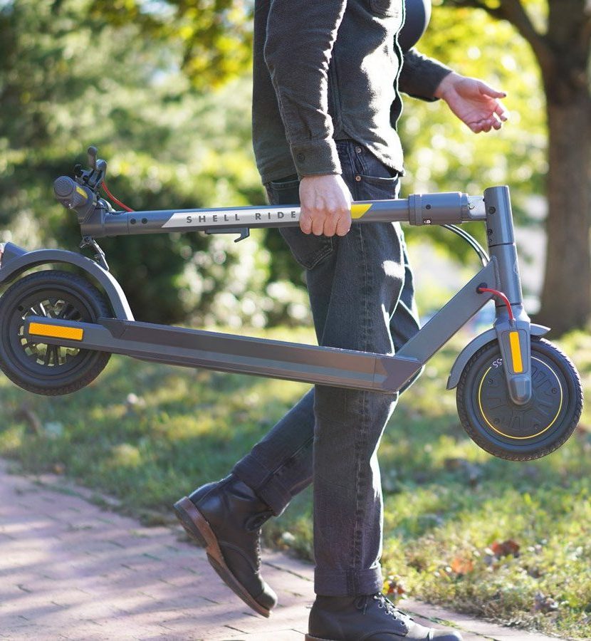 Photo Of Man Carrying SR-5S Scooter