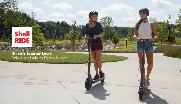 electric scooter laws blog image with two women riding electric scooters in a park