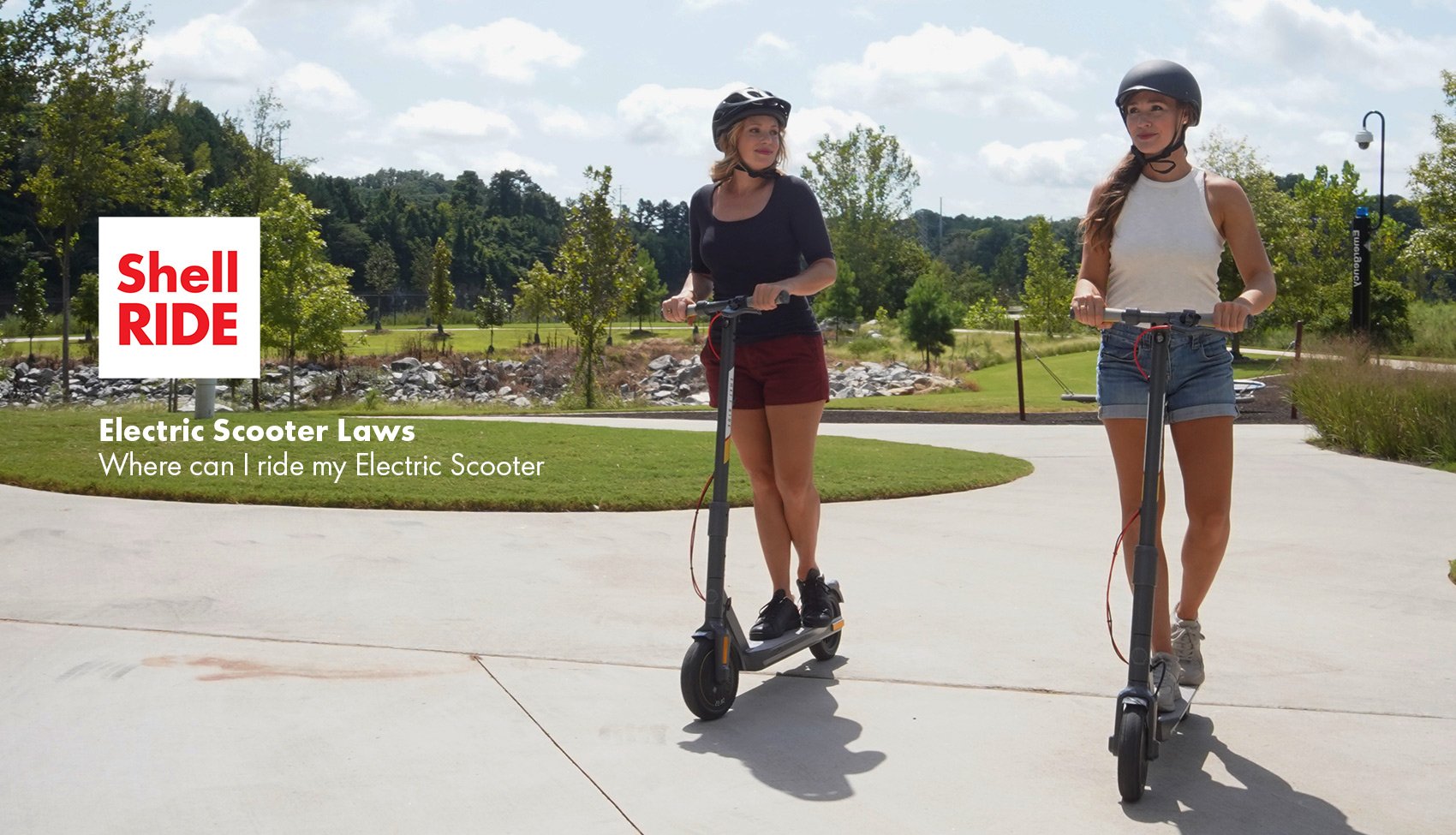 electric scooter laws blog image with two women riding electric scooters in a park