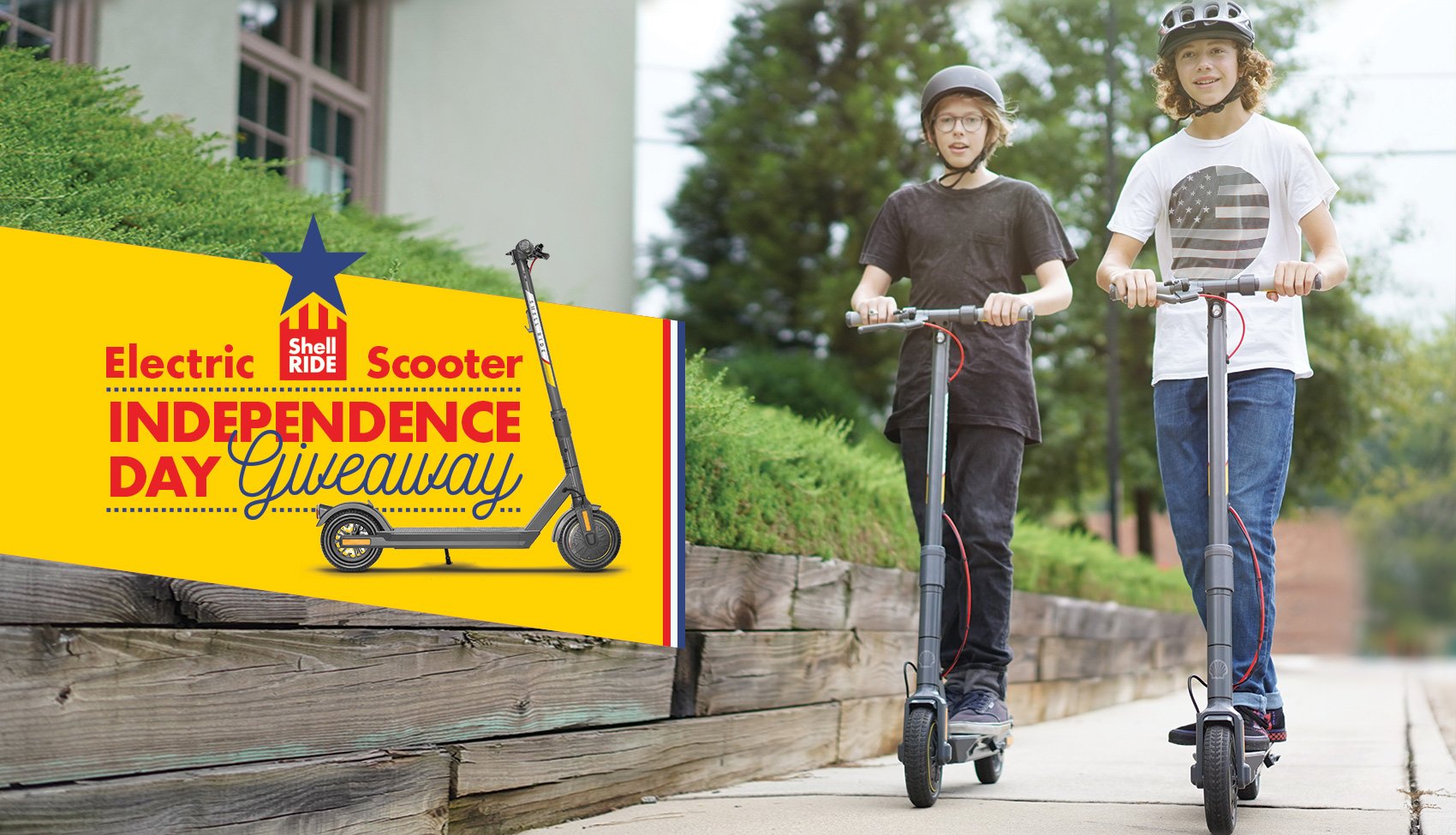 two teenage boys riding electric scooters in a city with an electric scooter independence day giveaway message
