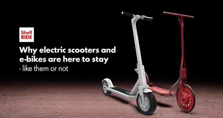 an antique scooter next to a modern electric scooter